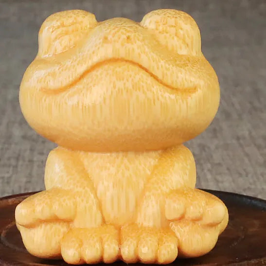Solid bamboo smiling frog carving ornament measuring 5cm tall with cartoon design