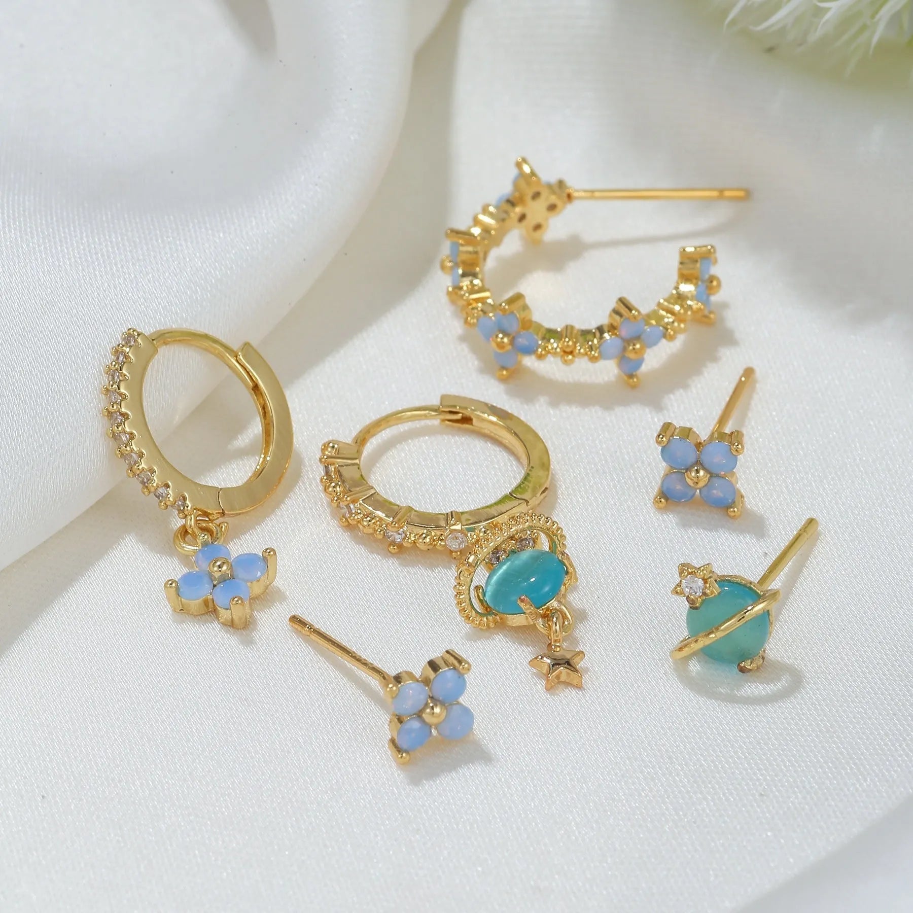 Blue protein flower nail ear studs with zircon mosaic details in gold or silver colour