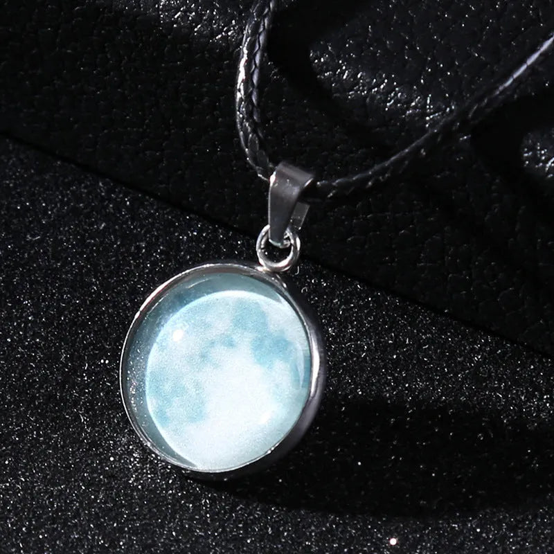 Alloy necklace with luminous glass pendant showing Christmas moon night sky and constellation design.