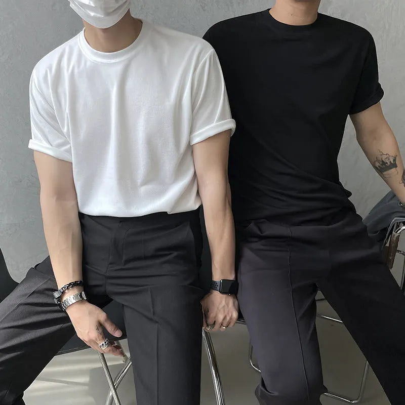 Men's slim fit cotton T-shirt in solid white colour, showing round neck and half sleeve design.