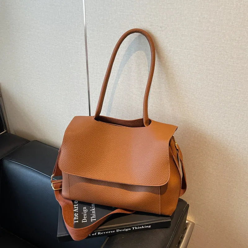 Square synthetic leather tote bag with double straps in a neutral colour.
