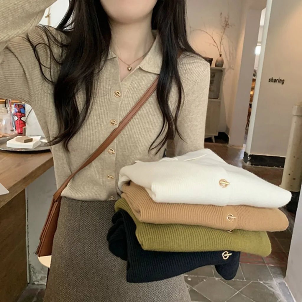 Beige loose fit long-sleeved viscose knitted cardigan top worn open as a layer.