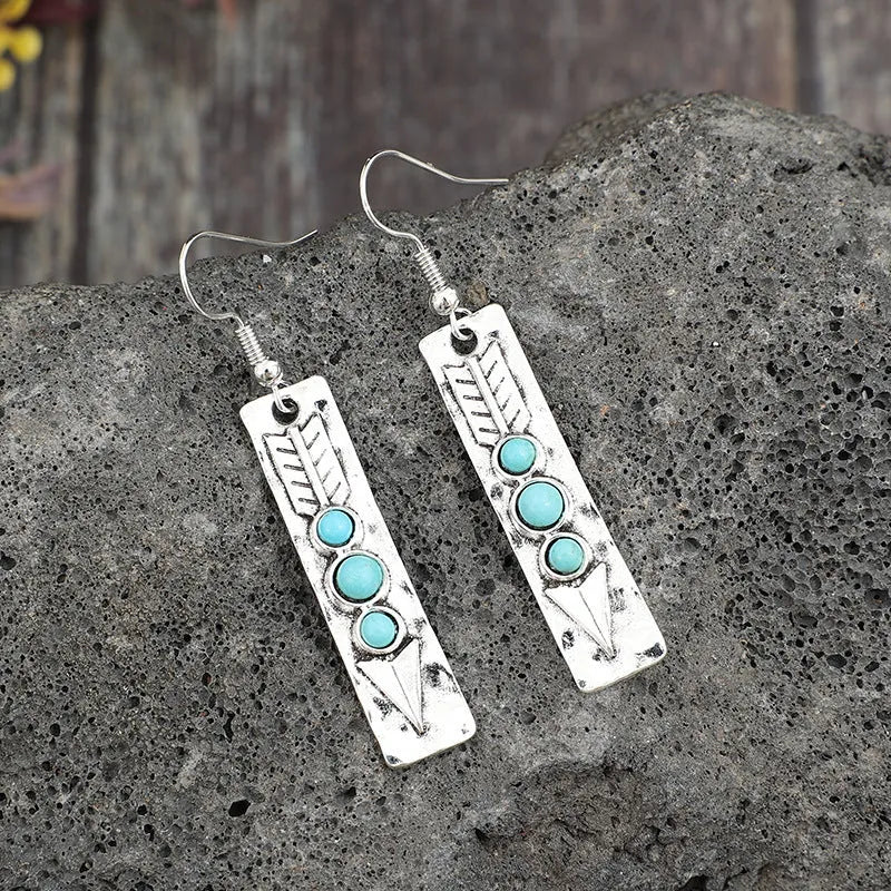 Silver geometric earrings with long strip design and turquoise inlay details