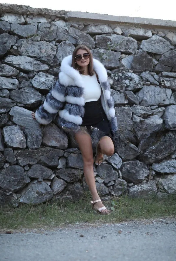 Women's loose hooded faux fur coat in street fashion style showing brown colour option