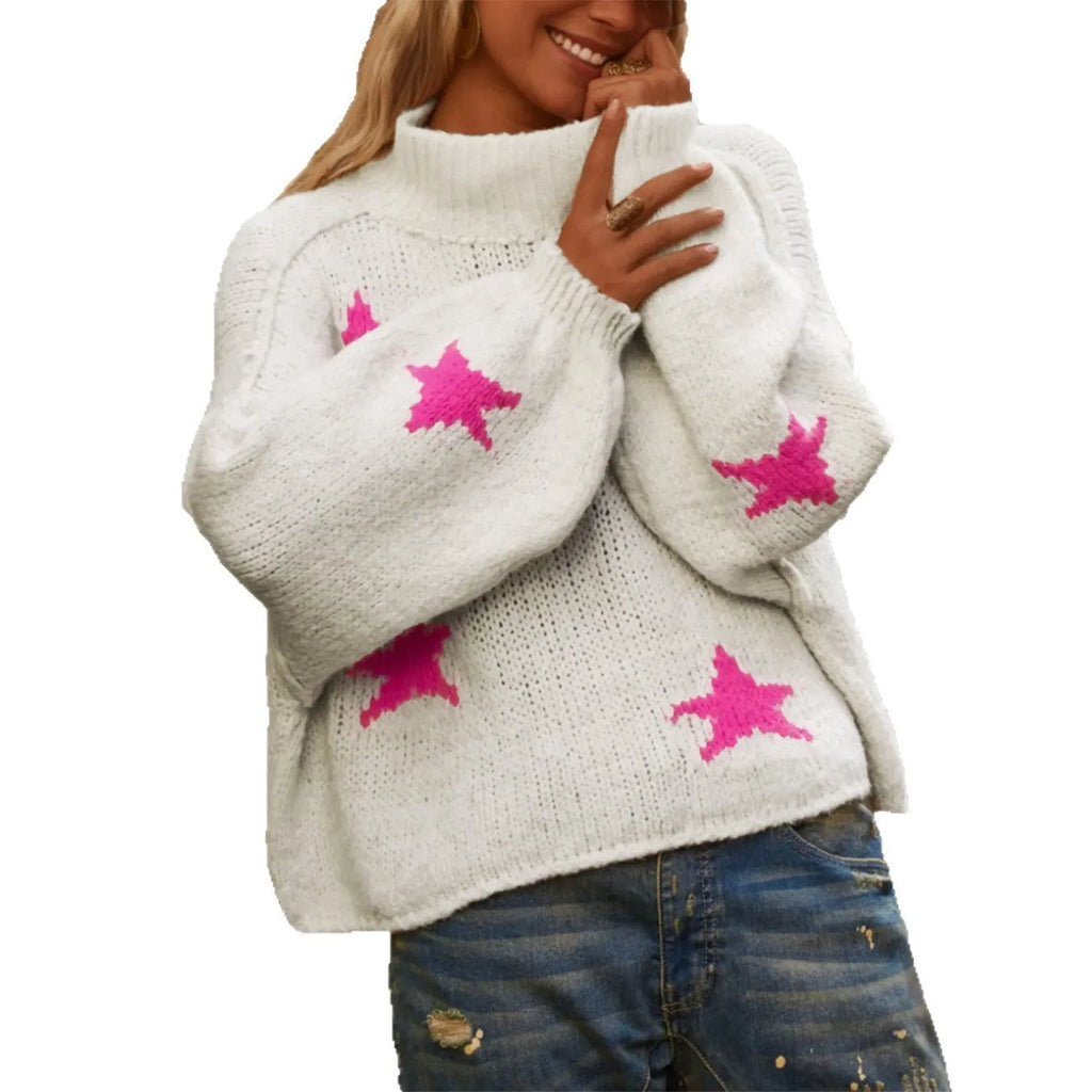White women's loose turtleneck pullover with a black five-pointed star pattern on the front, made from thick polyester fabric.