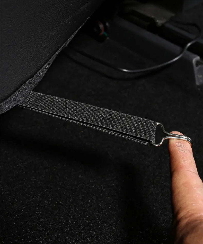 Pair of black leather anti kick pads for motorbike seat protection, 68cm long.