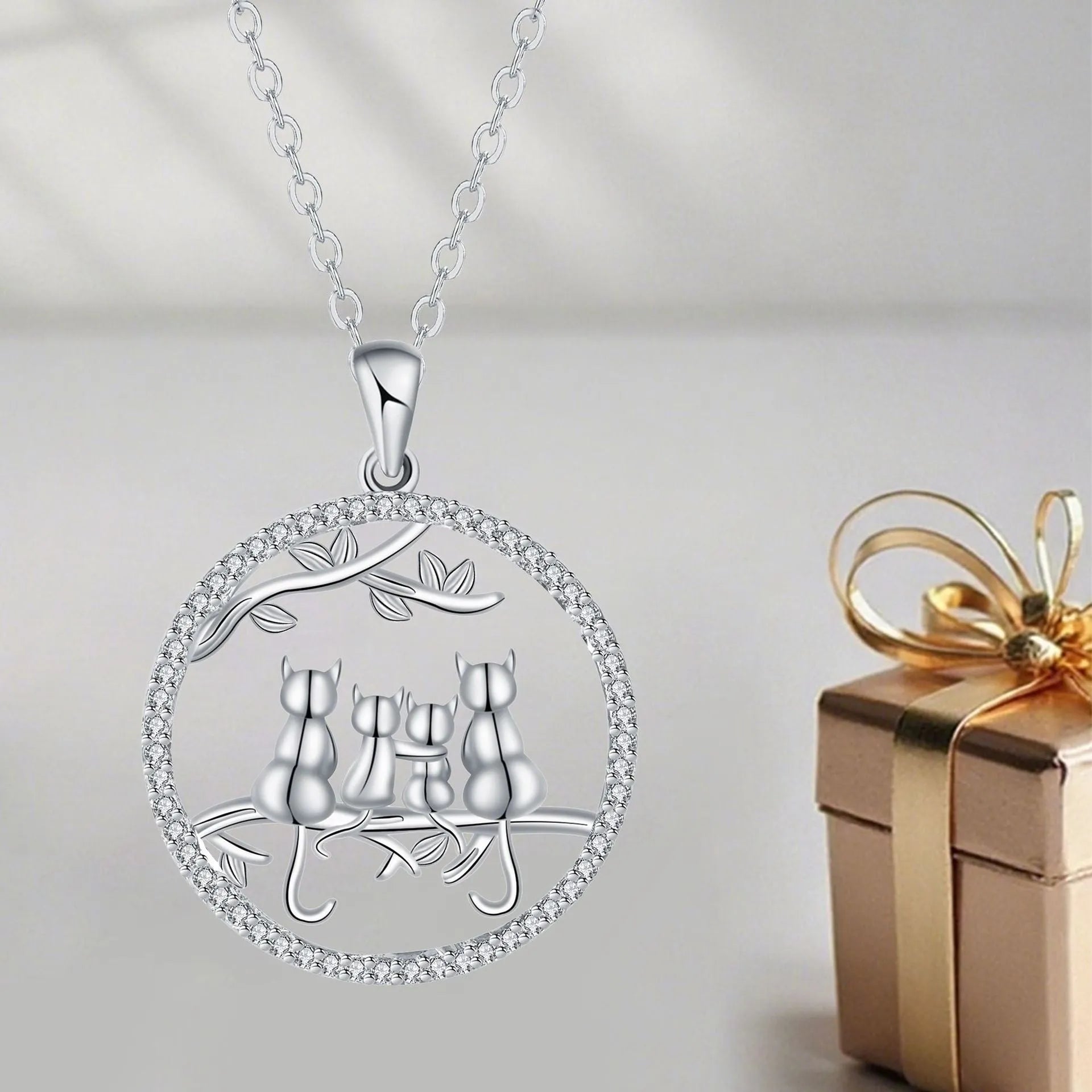 Four kitten pendant necklace with copper chain and cross link design