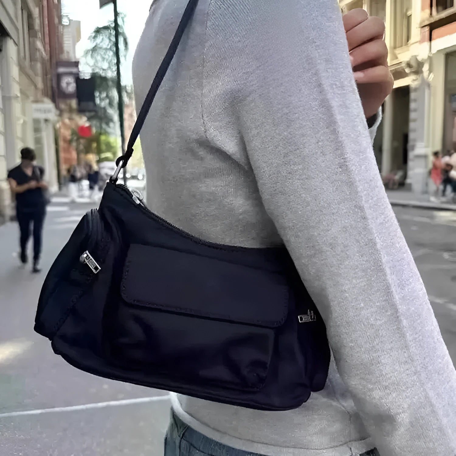 Black PU leather women's shoulder bag with double pockets and side line detail.