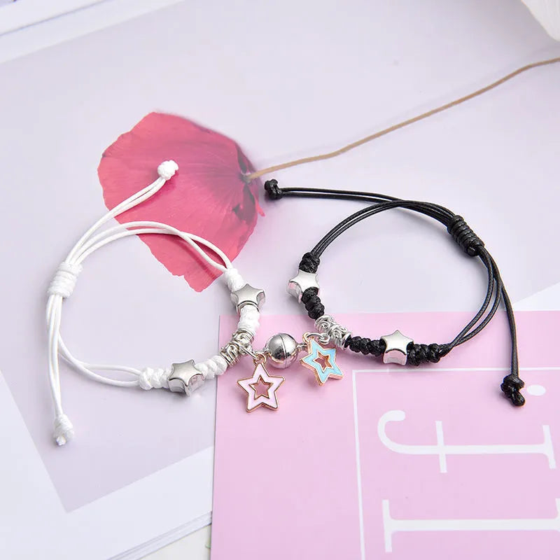 Alloy couple bracelets with magnet closure showing various design options including crown, clover, and text patterns