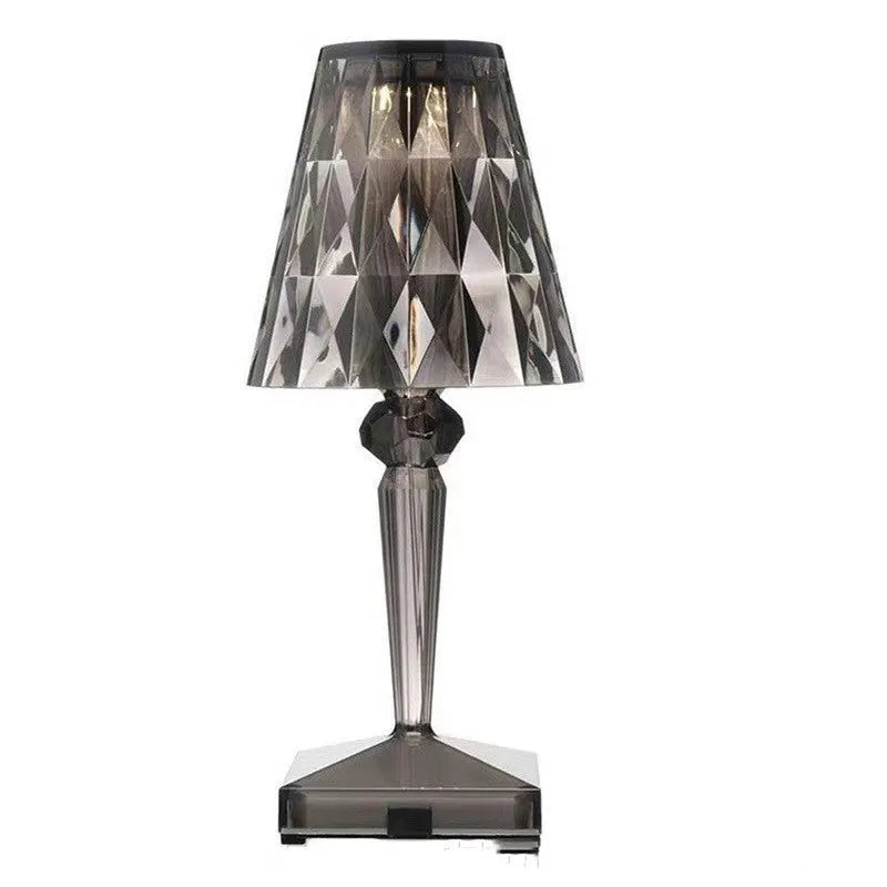 Rose gold plated acrylic portable touch night light with projection feature and rechargeable base on a wooden table