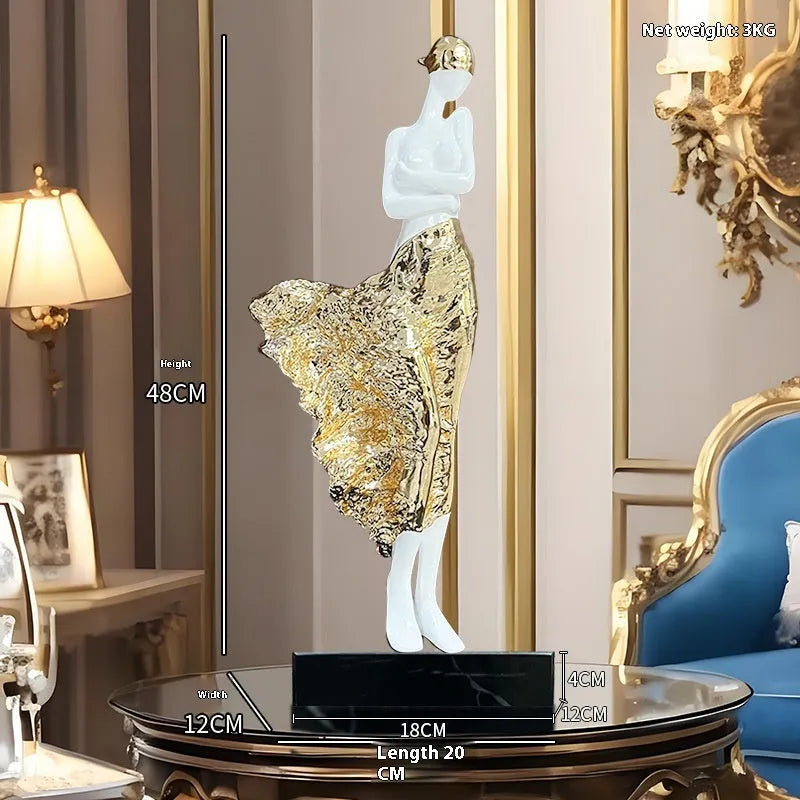 Tall gold resin character sculpture ornament with modern minimalist design on wooden surface