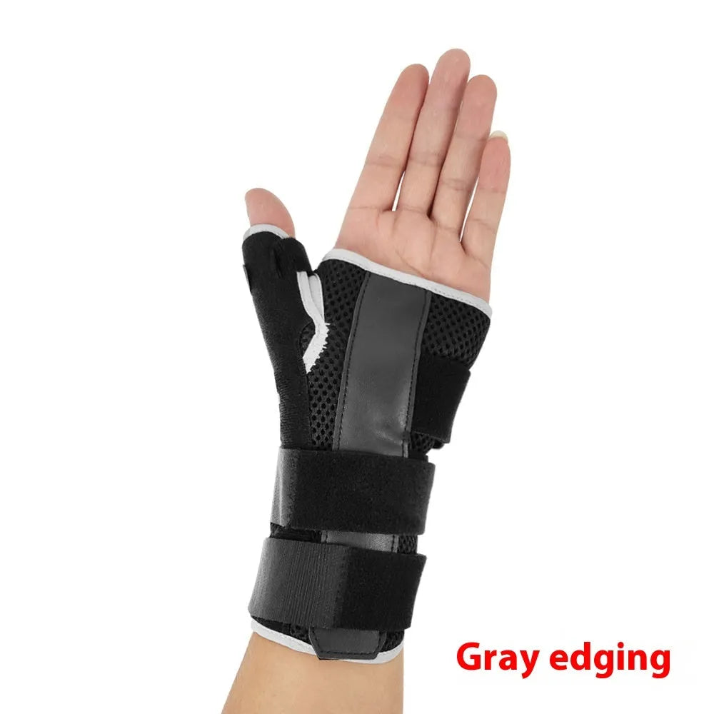 Carbon fibre style black sports wrist guard with grey edging and a thumb strap.