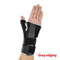 Carbon fibre style black sports wrist guard with grey edging and a thumb strap.