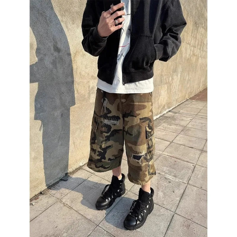 Men's loose camouflage jeans with retro patches and ripped detailing in cropped straight cut