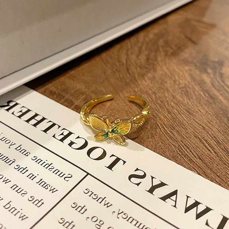 Creative Chinese butterfly women's copper ring with dripping oil treatment process in simple style.