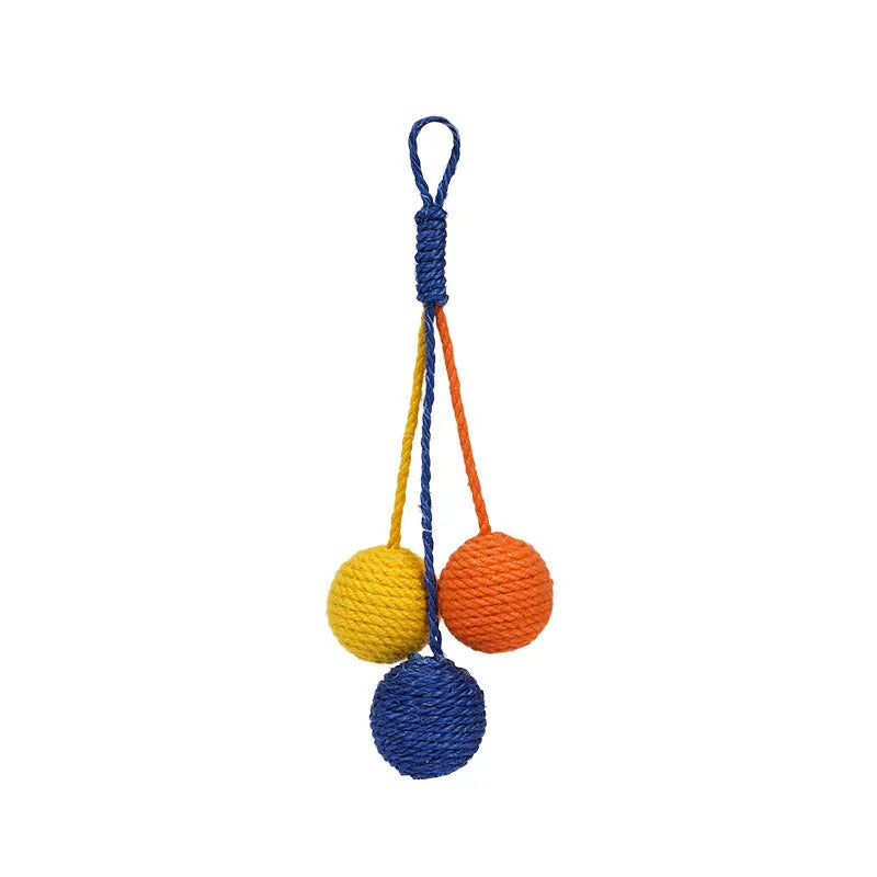 Set of three cat toys: a teaser stick, a catnip ball, and a self-play wand on a blue background.