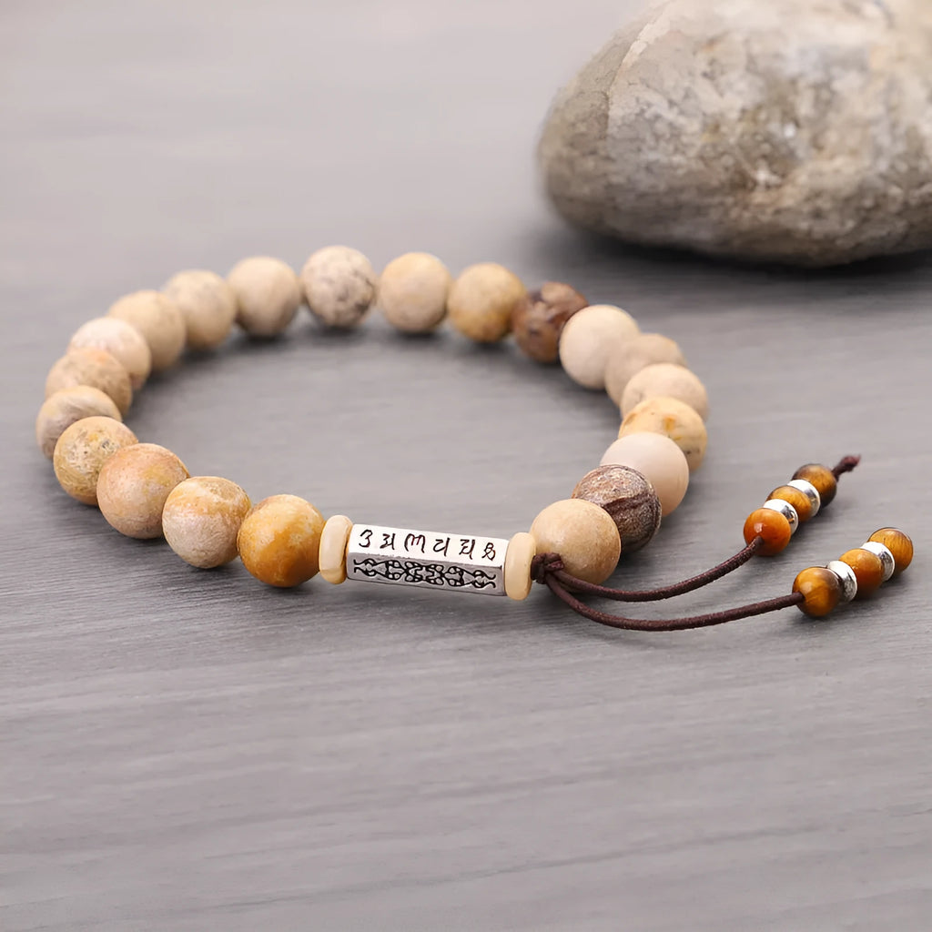 Handmade wood colour stone bead bracelet with retro design on a wrist