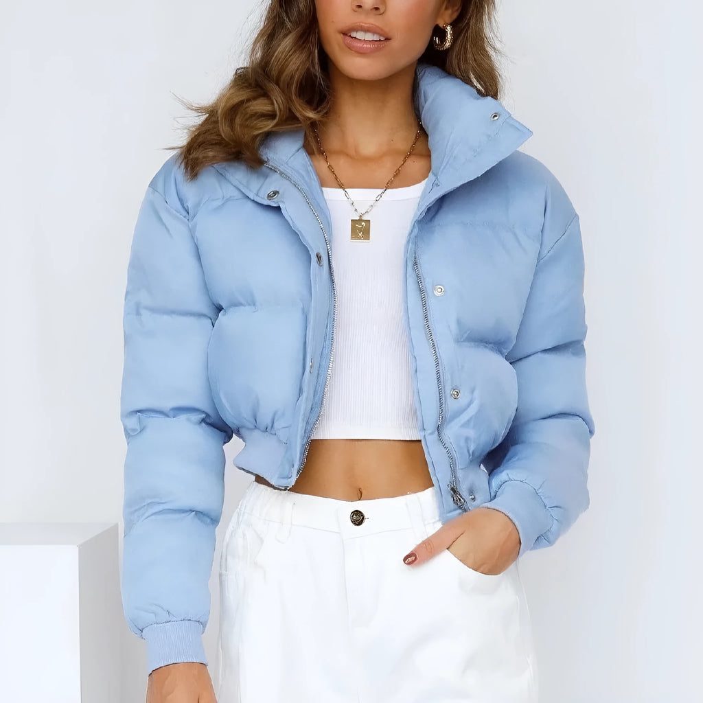 Women's loose blue polyester jacket with regular long sleeves showing front view