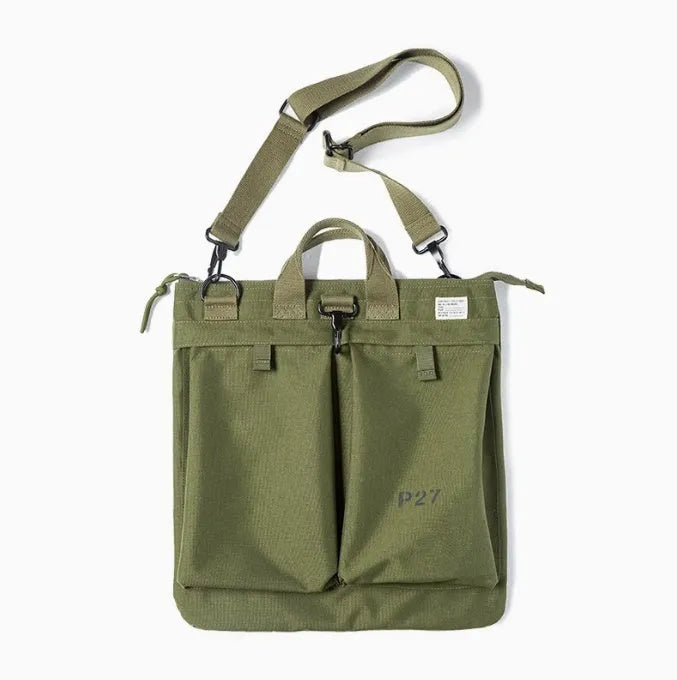 Canvas crossbody messenger bag in military green with shoulder strap showing vertical square shape and zipper closure