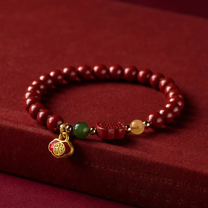 Emperor Sandstone Cinnabar bracelet with Fu character charm, showing 6mm and 8mm bead size options.