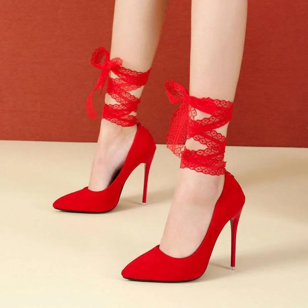 Black platform heel with shallow open toe and thin lace straps on a 12cm heel.