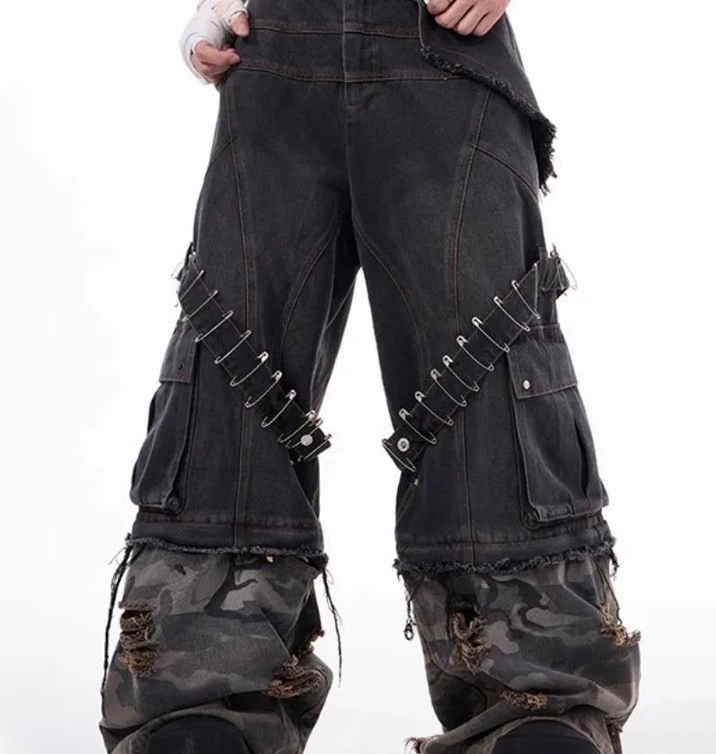Men's grey camouflage print jeans with splicing panel construction and ribbon detail.