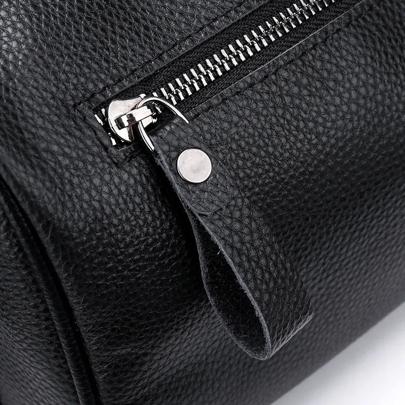 Black genuine leather one-shoulder crossbody bag showing front view and size.