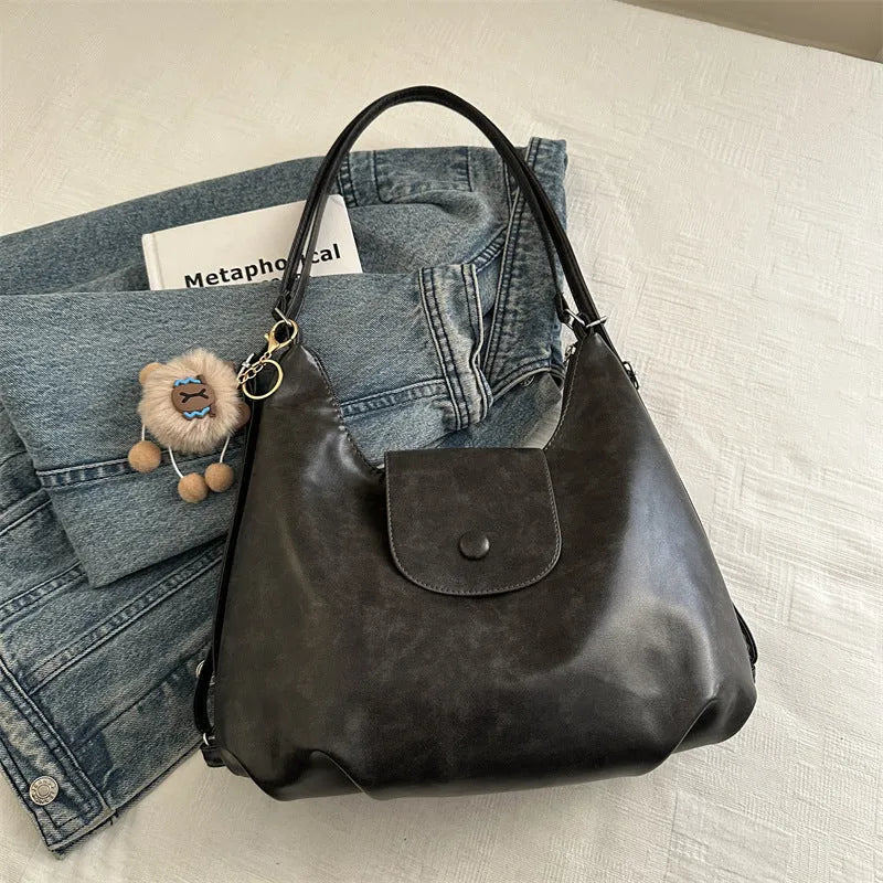 Women's black PU leather single shoulder bag with horizontal square shape and dedicated phone compartment