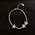 Gold tone geometric women's bracelet with quadrilateral design and inlaid zircon stones on copper base
