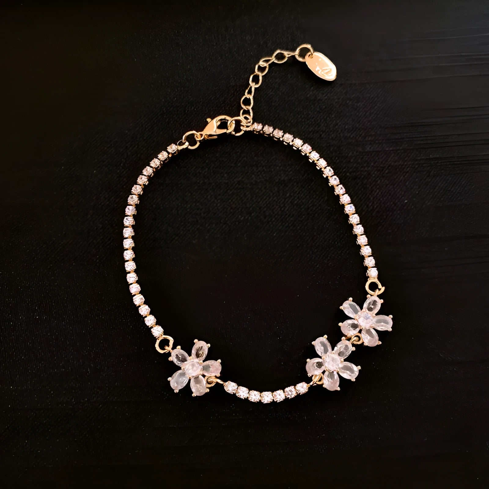 Gold tone geometric women's bracelet with quadrilateral design and inlaid zircon stones on copper base