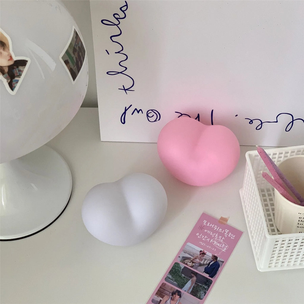 Small vinyl atmosphere lamp with warm glowing light in trumpet shape available in pink or white