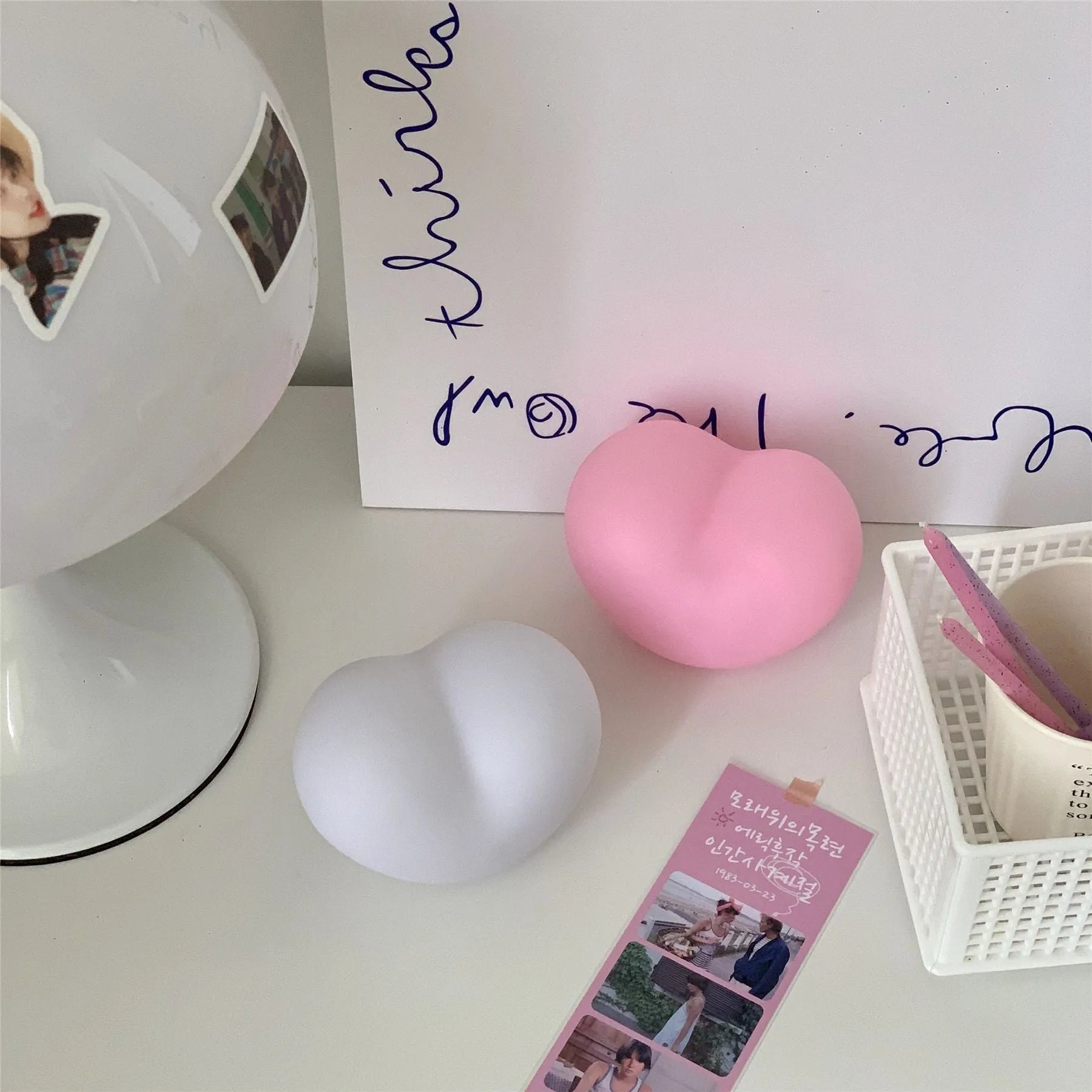 Small vinyl atmosphere lamp with warm glowing light in trumpet shape available in pink or white