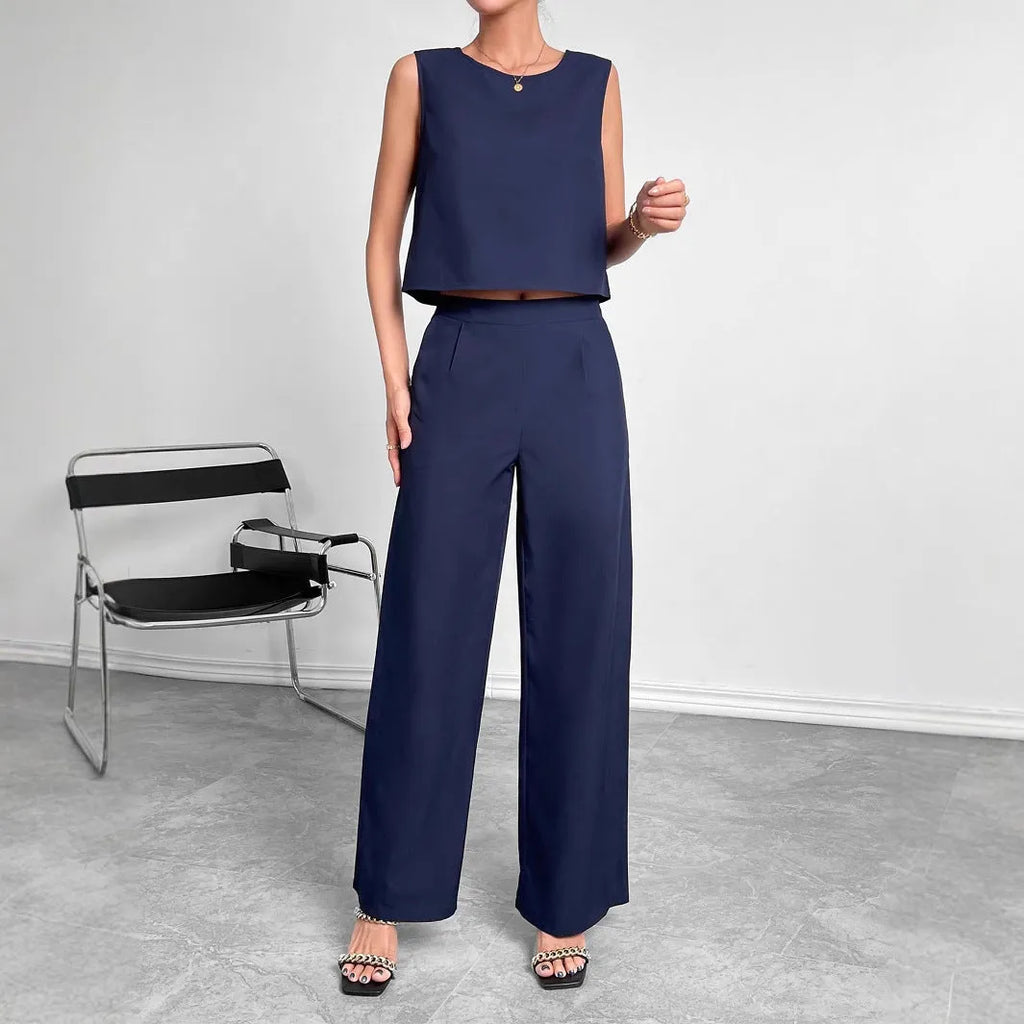 Red sleeveless top and wide leg trousers two-piece set for women on a hanger.