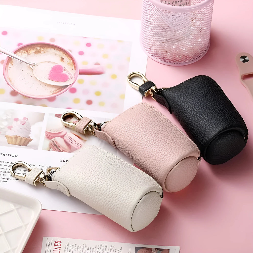 Minimalist black PU leather zippered key case for men, shown closed with a silver zipper.