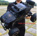 Large black 4WD off-road remote control climbing car with 2.4G wireless controller
