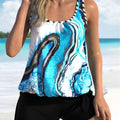 Blue tie-dye floral print plus size women's swimsuit set with top and shorts on a hanger.