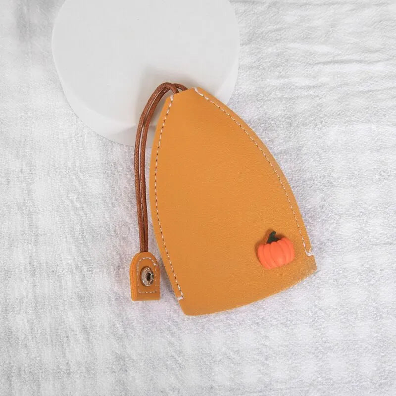Cartoon pull-out key case in PU leather with colourful design, showing compact 14cm by 7.5cm dimensions