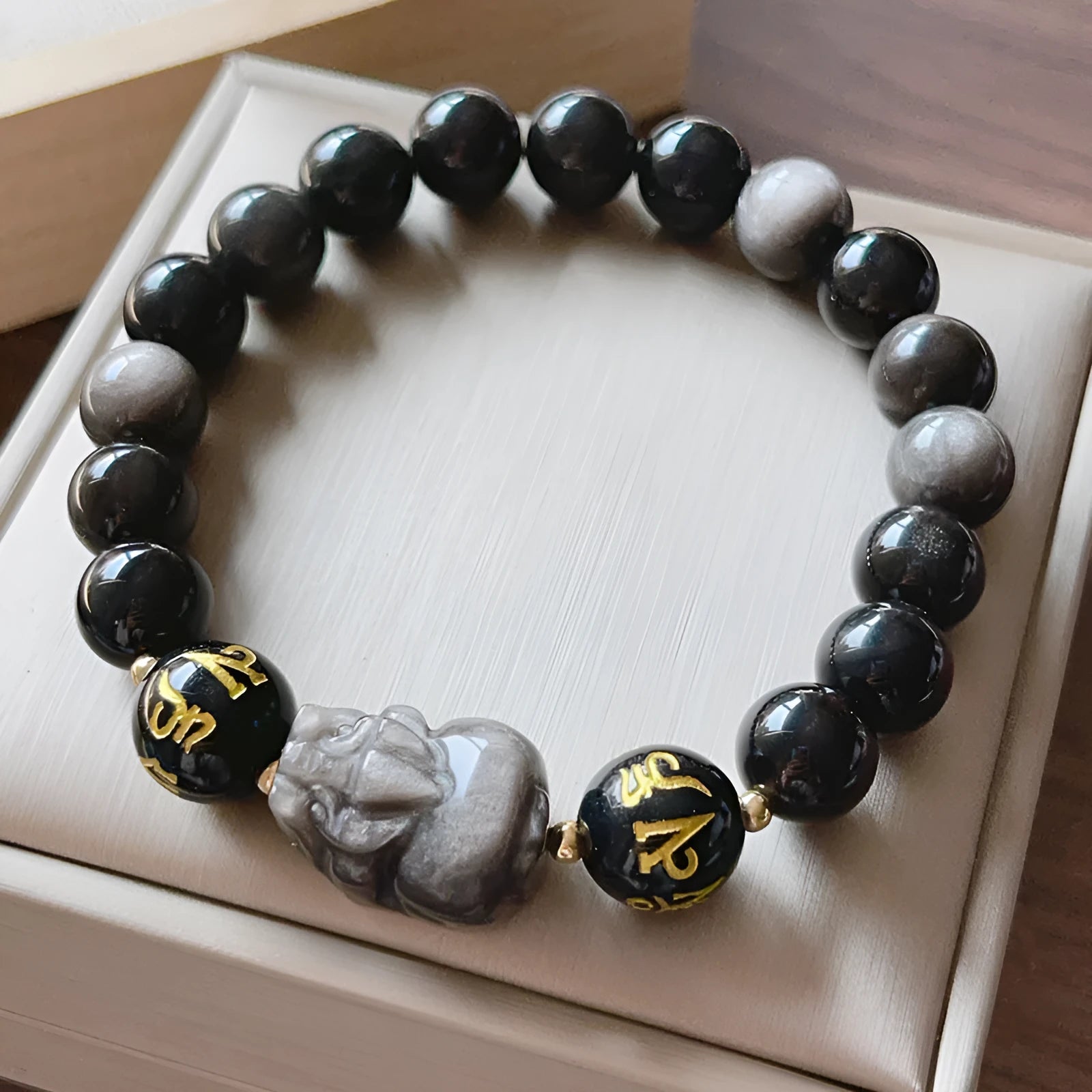 Men's silver stone bracelet with Chinese zodiac designs and proverb beading in handcrafted traditional style