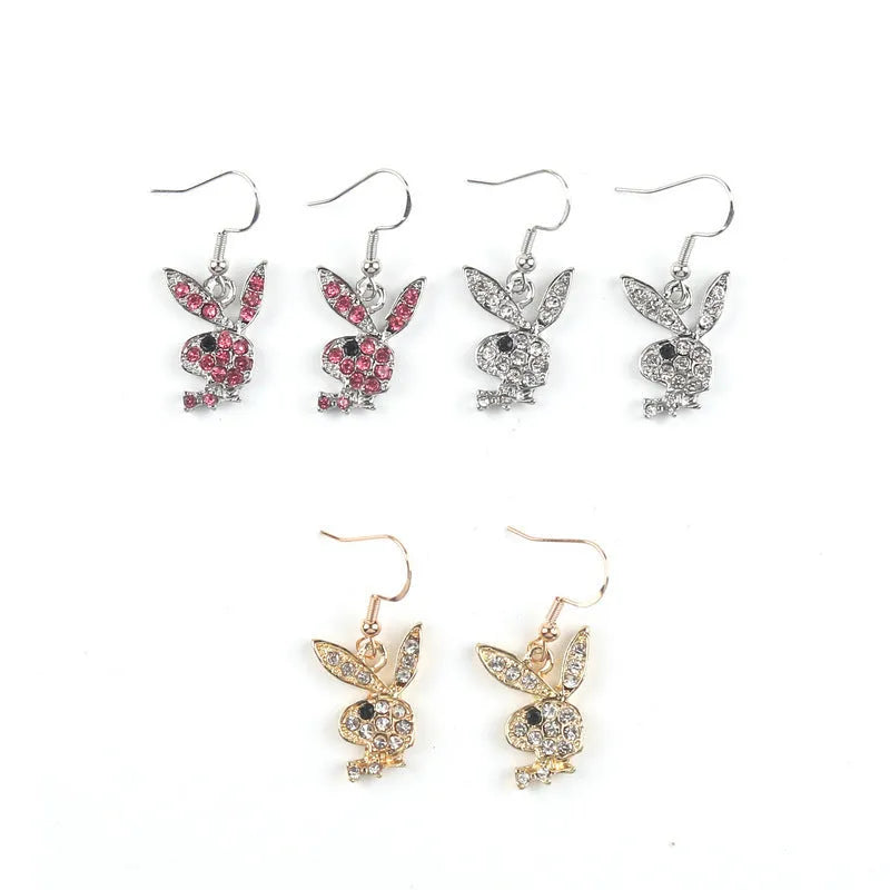 Silver, pink, and gold alloy stud earrings with a full diamond cartoon rabbit design.