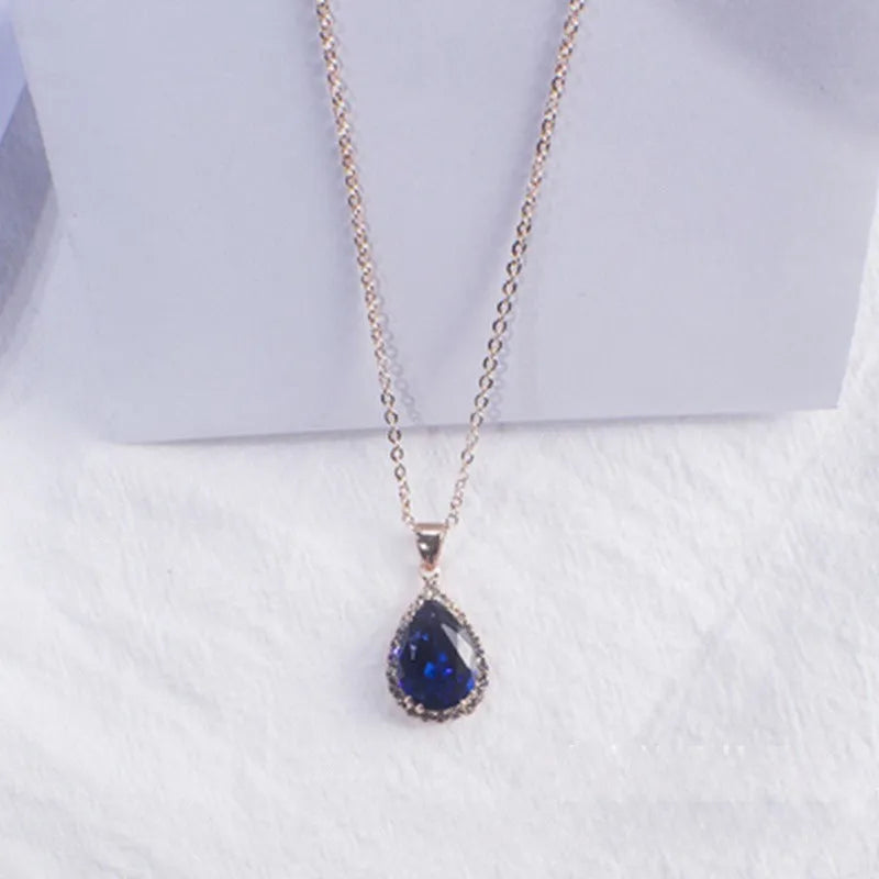 Rose gold pink drop shape women's necklace with geometric rhinestone detailing and alloy construction