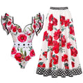 Women's printed one-piece swimsuit with matching cover-up skirt in rose pink.