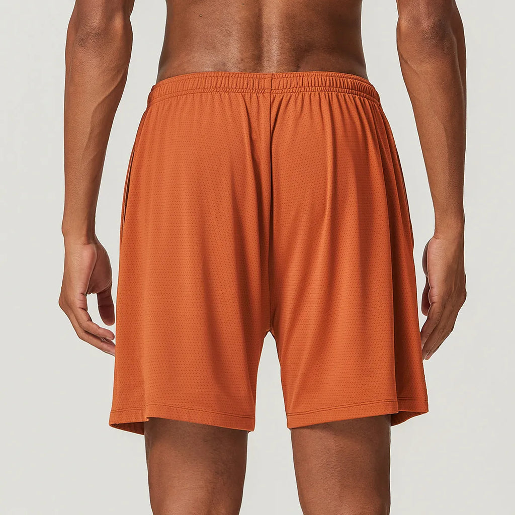 Man's quick-drying athletic shorts in khaki colour, showing double-layer construction and mid-waist fit.