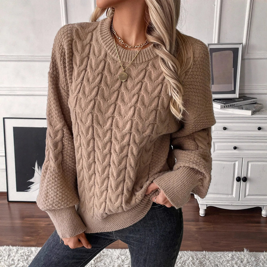 Women's khaki round neck sweater with twisted stitch detail and loose fit silhouette