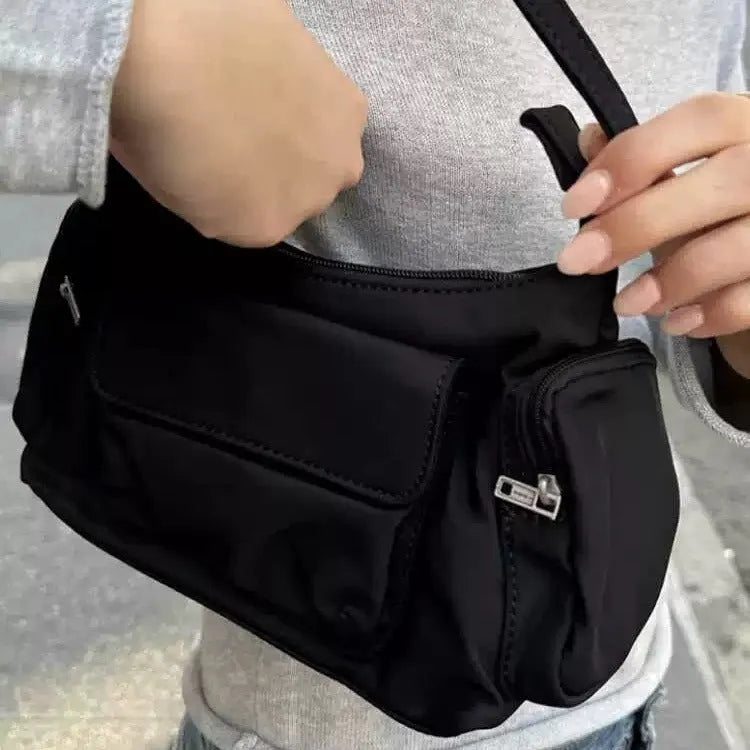 Black PU leather women's shoulder bag with double pockets and side line detail.