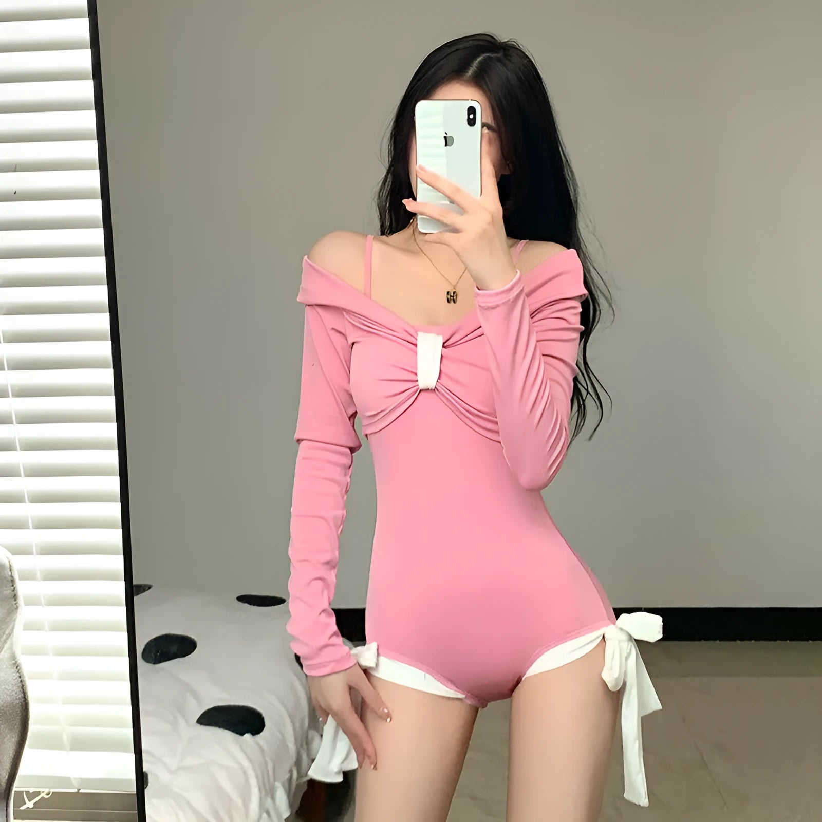 Women's long sleeve one-piece swimsuit in black or pink polyester
