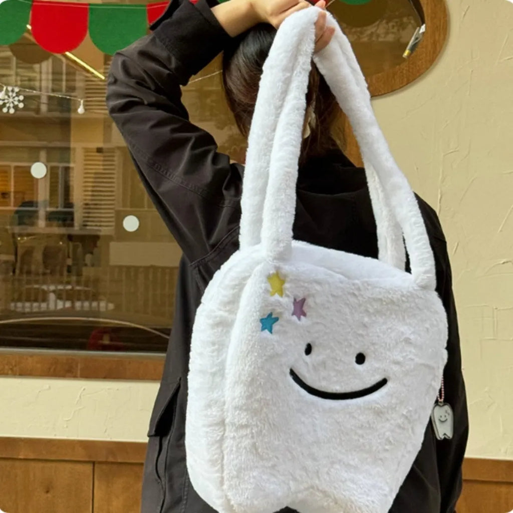 White plush large tooth shoulder tote bag with crossbody strap and zipper closure