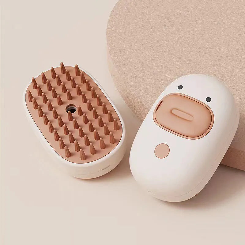 White and yellow pet steam brush with silicone teeth and water tank for dog and cat grooming