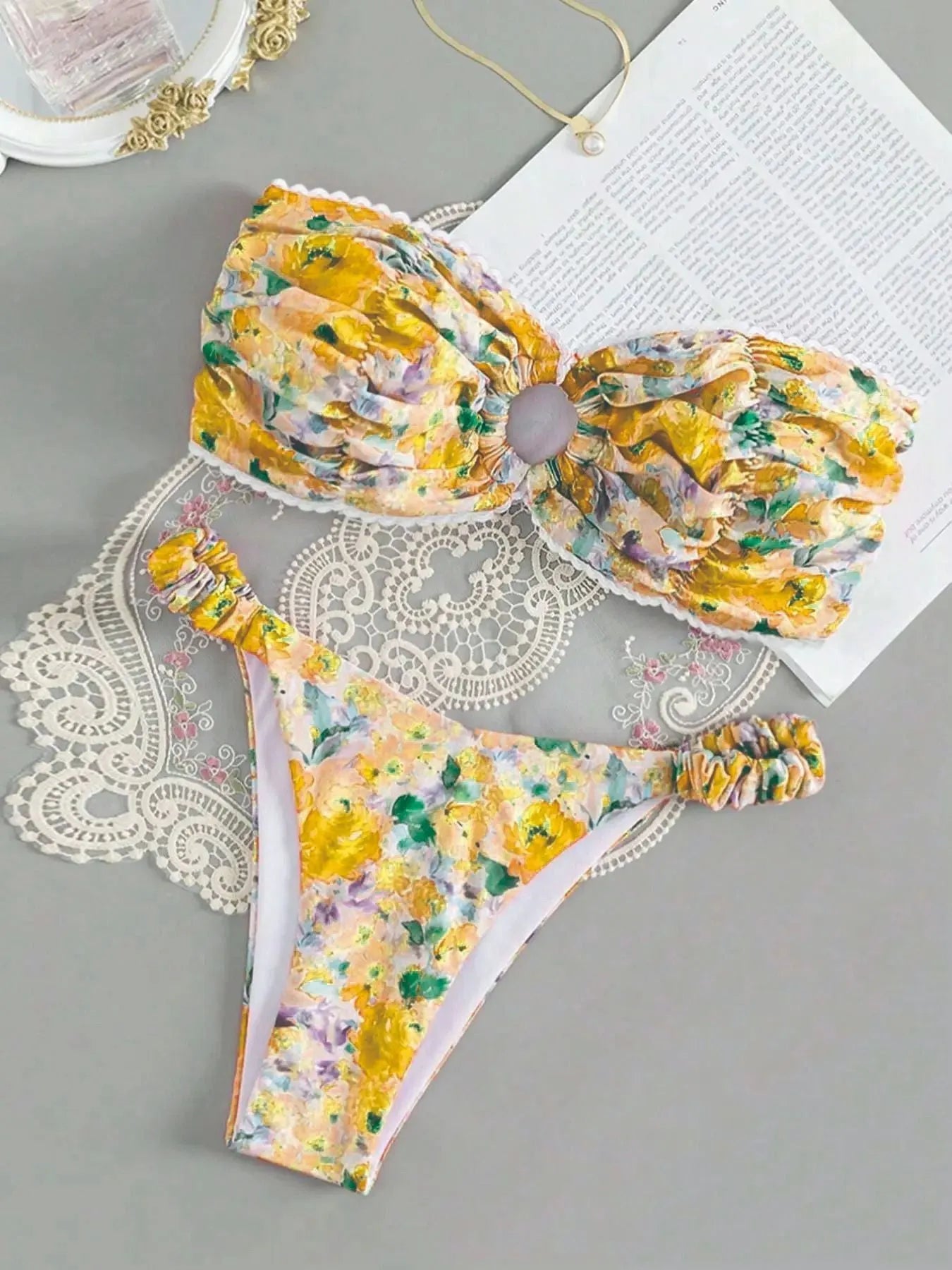 Printed tube top bikini set with lace detail and floral pattern in blue colour