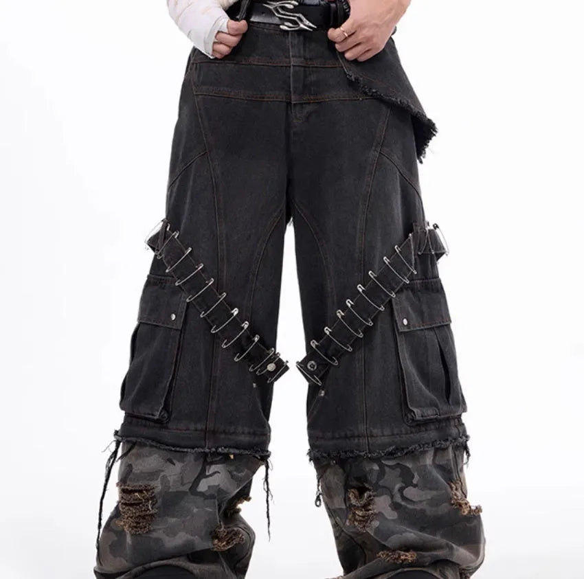 Men's grey camouflage print jeans with splicing panel construction and ribbon detail.