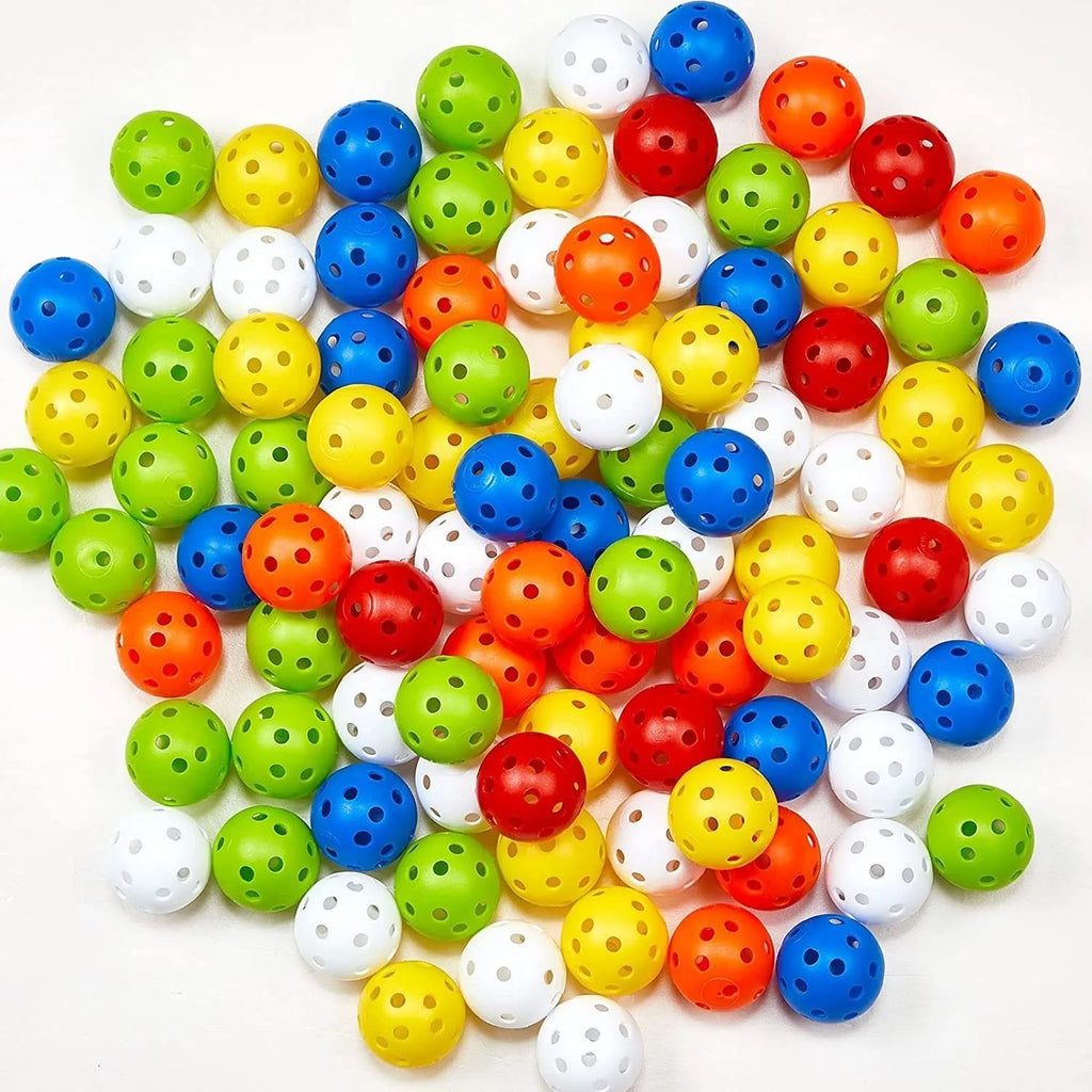 Six multi-colour 42mm golf practice balls in red, orange, blue, green, white, and yellow in a net.